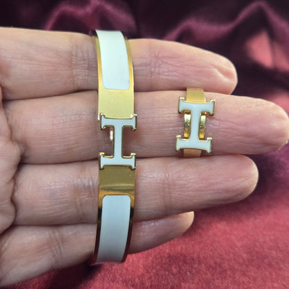 H-Signature Bangle Set in Gold finish on a neutral background