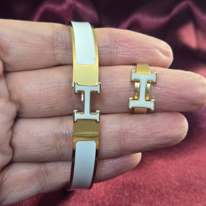 H-Signature Bangle Set in Gold finish on a neutral background