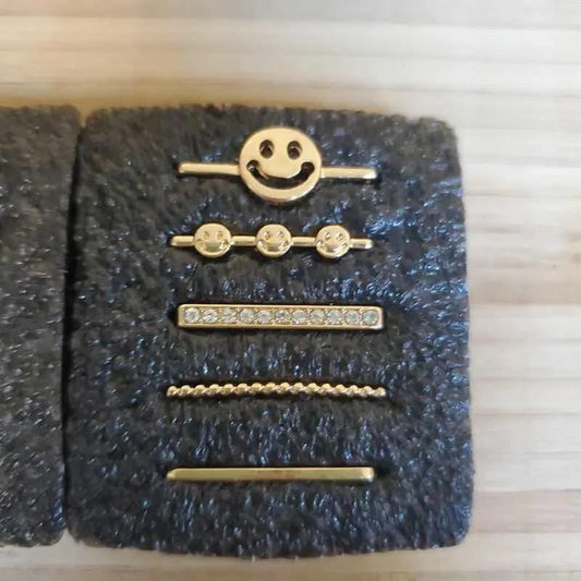 Happy Face Charms Set in Gold finish, with cubic zirconia stone on a neutral background