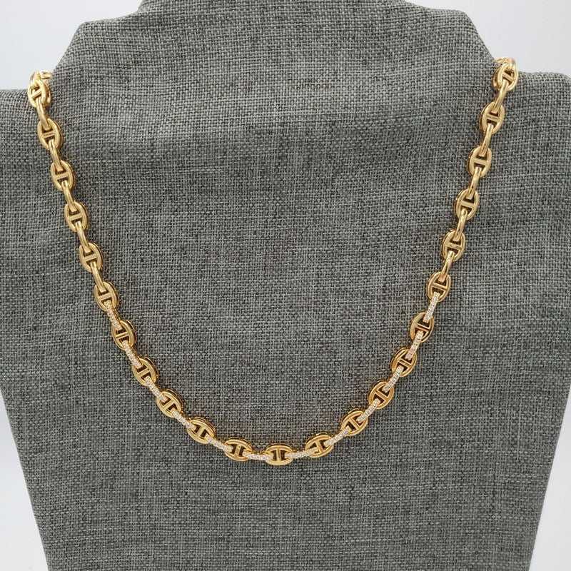 Horseshoe Chain Necklace in Gold finish, with cubic zirconia stone on a neutral background