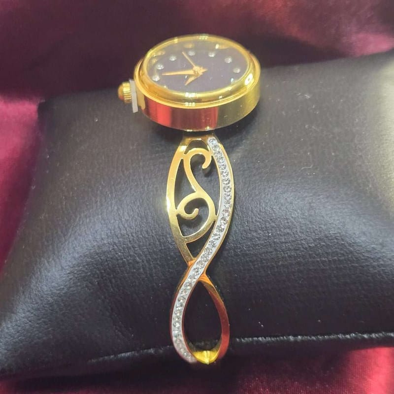 Infinity Bangle watch in Gold finish, with cubic zirconia stone on stones in an infinity design