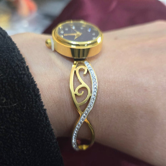 Infinity Bangle watch in Gold finish, with cubic zirconia stone on stones and a black dial