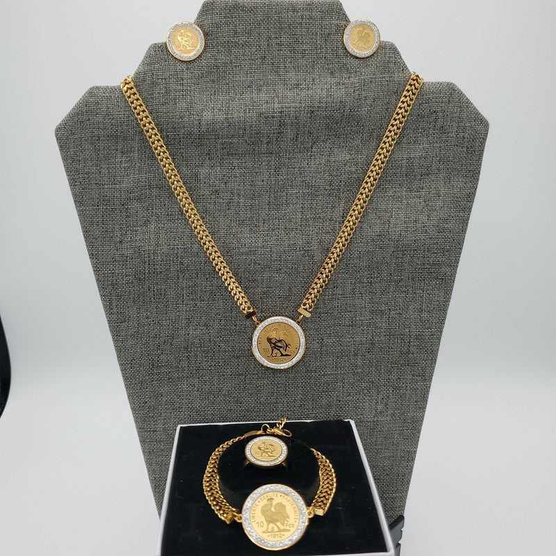 Lira Coin Jewelry Set in Gold finish, with cubic zirconia stone on a neutral background