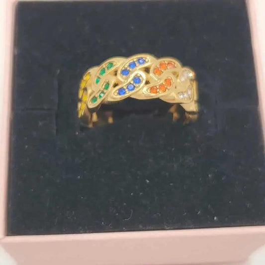 Lustrous Colorful Ring in Gold finish, with cubic zirconia stone on a neutral background