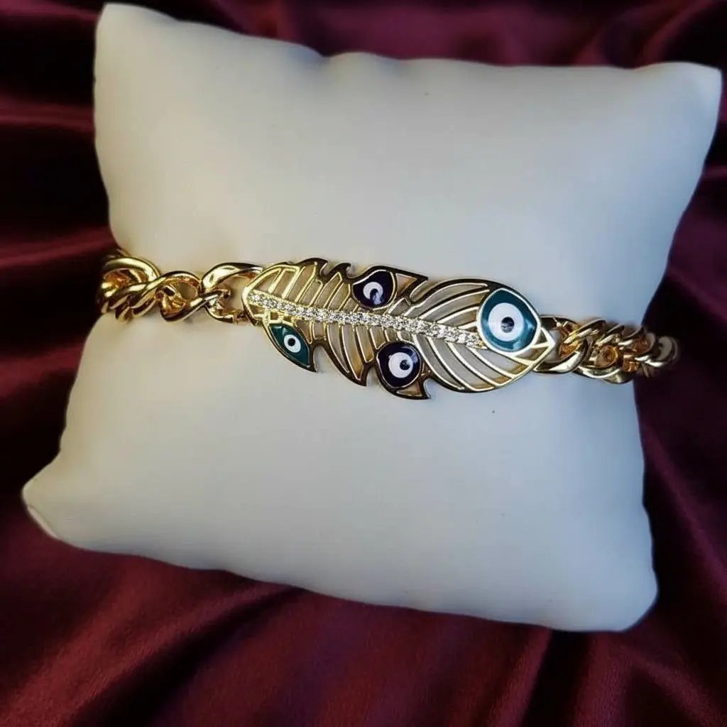 Lustrous Feather Bracelet in Gold finish, with cubic zirconia stone on stones and colorful evil eye enamel