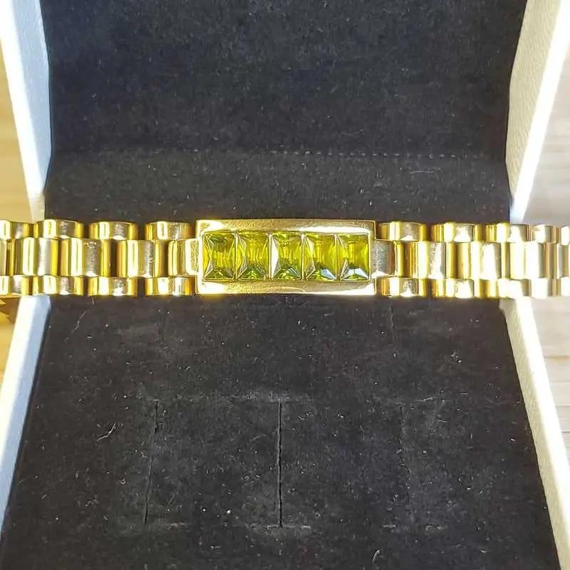 Luxury Bracelet in Gold finish on stones displayed in a black velvet jewelry box