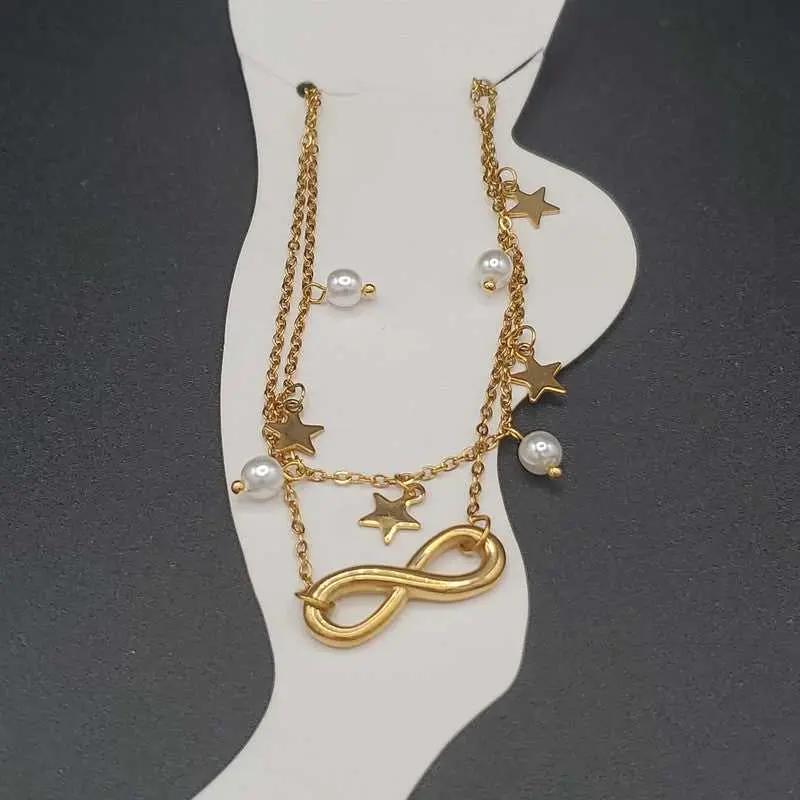 Minimalist Infinity Anklet in Gold finish, with pearl stone on a neutral background