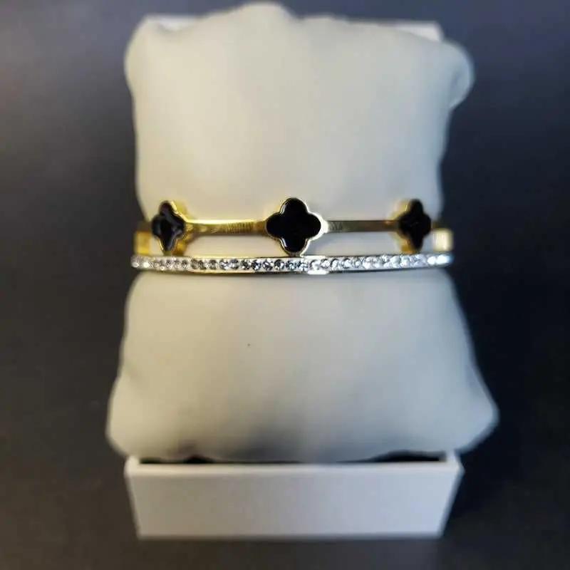 Modern Clover Bangle in Gold and Silver finish, with cubic zirconia stone on stones