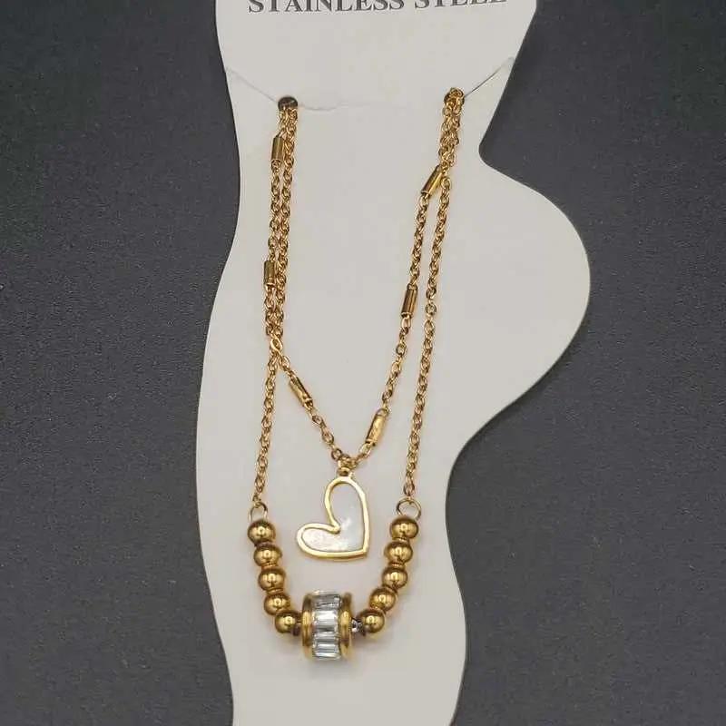 Modern Heart Anklet in Gold finish, with cubic zirconia stone on stones