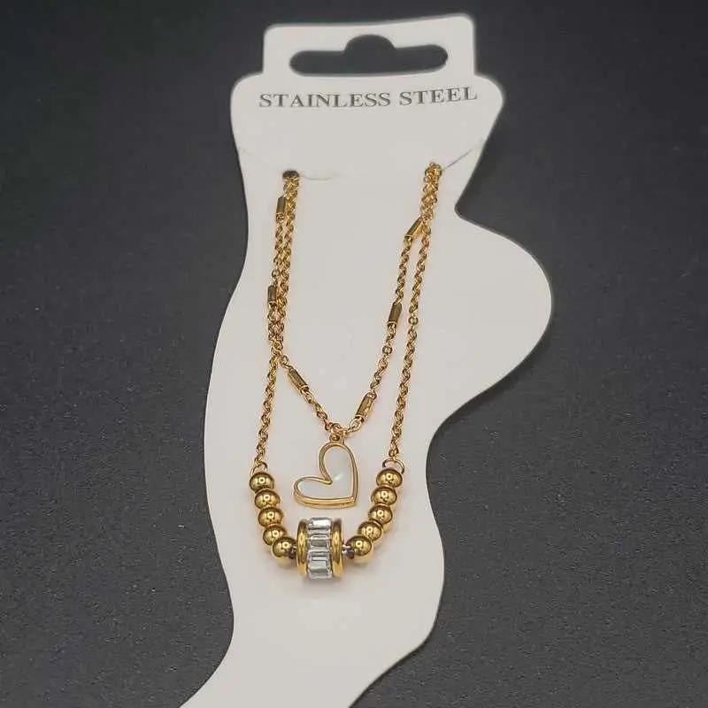 Modern Heart Anklet in Gold finish, with cubic zirconia stone on barrel bead