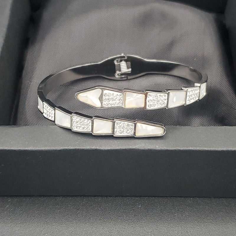 Modern Snake Bangle in Gold finish, with cubic zirconia stone on stones