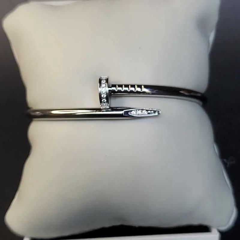 Modern Stones Nail Bangle in Silver finish, with cubic zirconia stone on stones