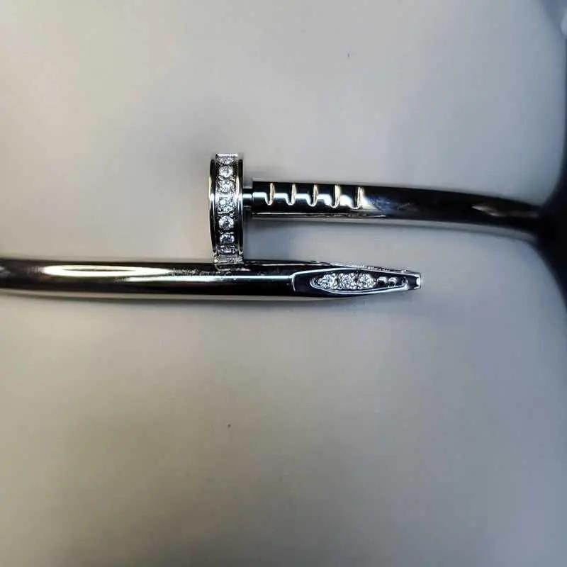 Modern Stones Nail Bangle in Silver finish, with cubic zirconia stone on stones