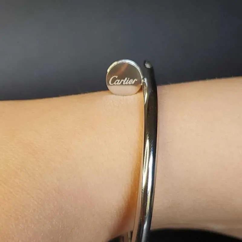 Modern Stones Nail Bangle in Silver finish, with cubic zirconia stone on a wrist