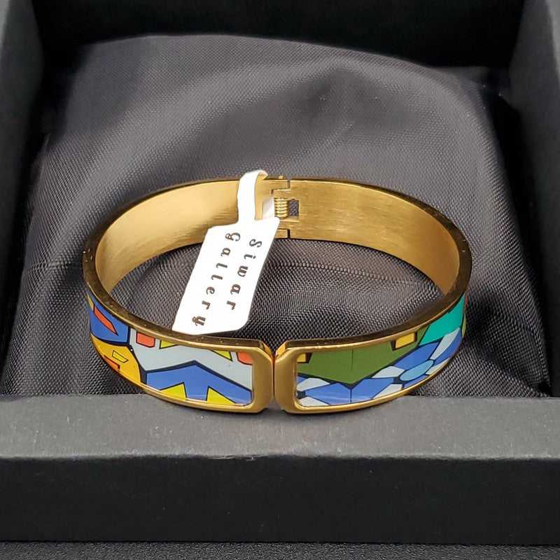 Radiant Colorful Bangle in Gold finish on a neutral background