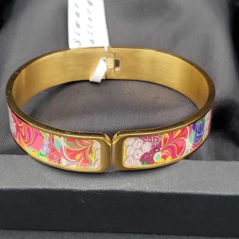 Radiant Colorful Bangle in Gold finish on a neutral background