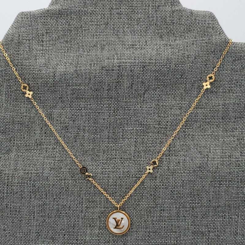 Radiant Monogram Necklace in Gold finish on logo pendant and clover-shaped accents