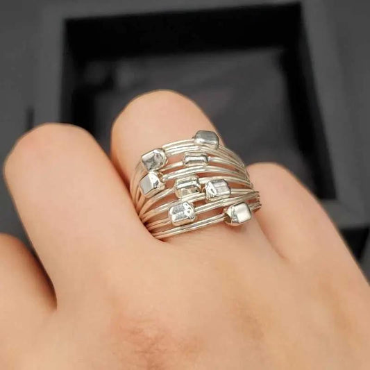 Refined Cubes Ring in Silver finish on a neutral background