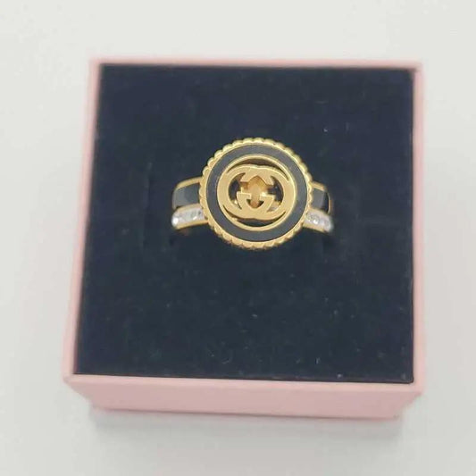 Signature Design Ring in Gold finish, with cubic zirconia stone on stones on the band