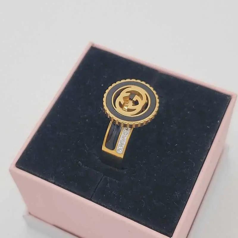 Signature Design Ring in Gold finish, with cubic zirconia stone on stones