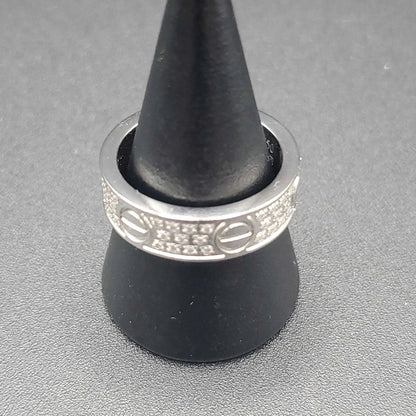 Silver Screw Ring in Silver finish, with cubic zirconia stone on a neutral background