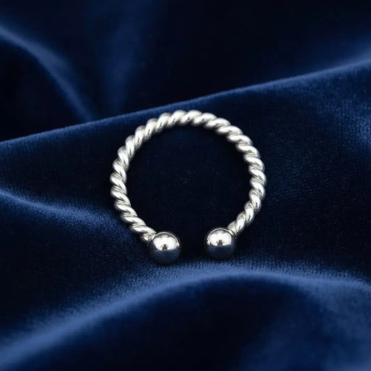 Simple Design Ring in Silver finish on a neutral background