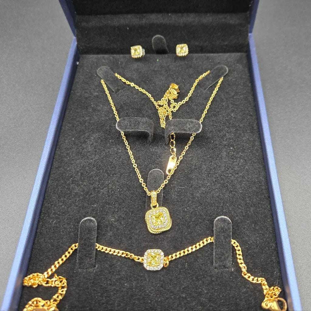 Square Diamond Set in Gold finish, with cubic zirconia stone on stones, including earrings, a necklace, and a bracelet