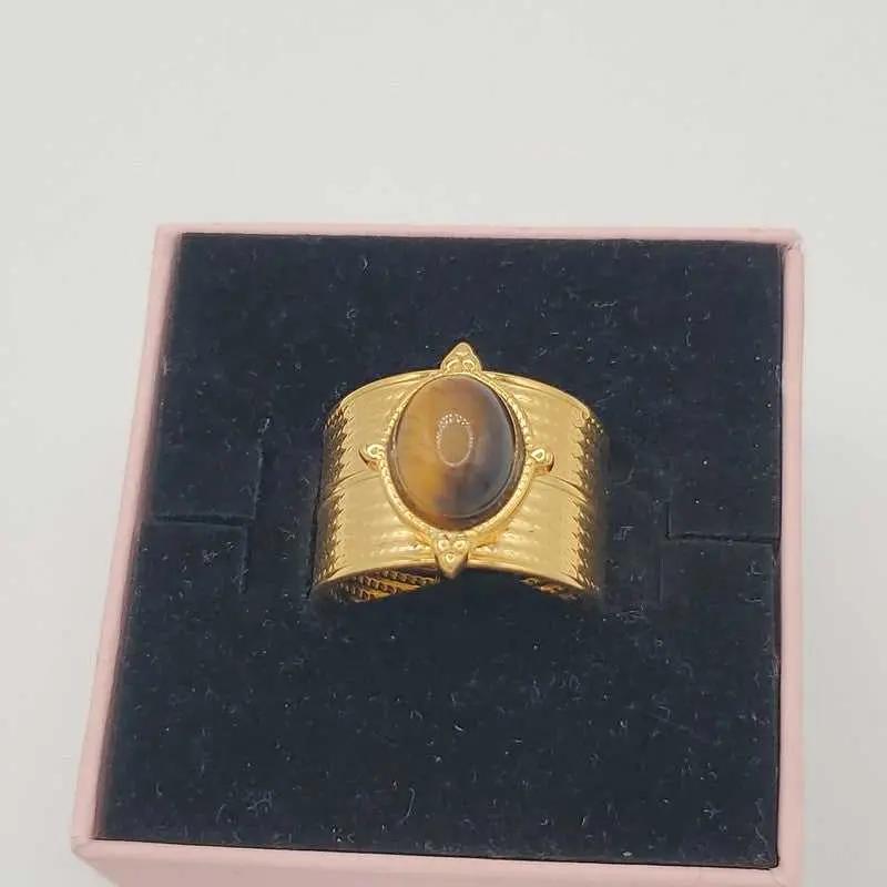 Tiger eye Ring in Gold finish on a neutral background