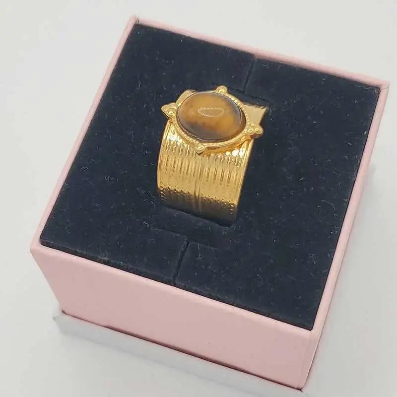 Tiger eye Ring in Gold finish on a neutral background